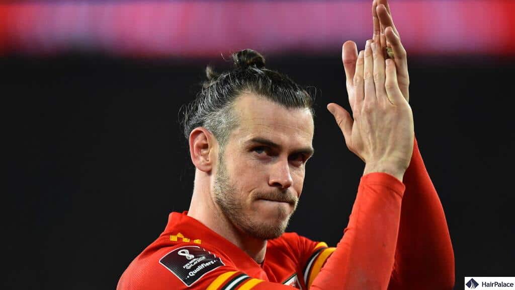 Wales fans left baffled as Gareth Bale spends an age fixing man bun while  trying to tackle Polish player  Wales Online