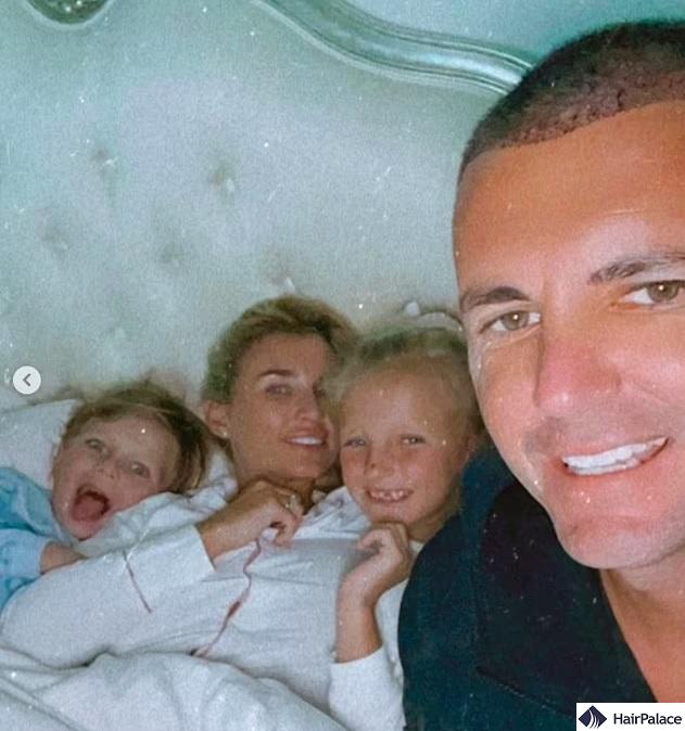Greg sparked speculation by sportinga buzz cut in this cozy family shot